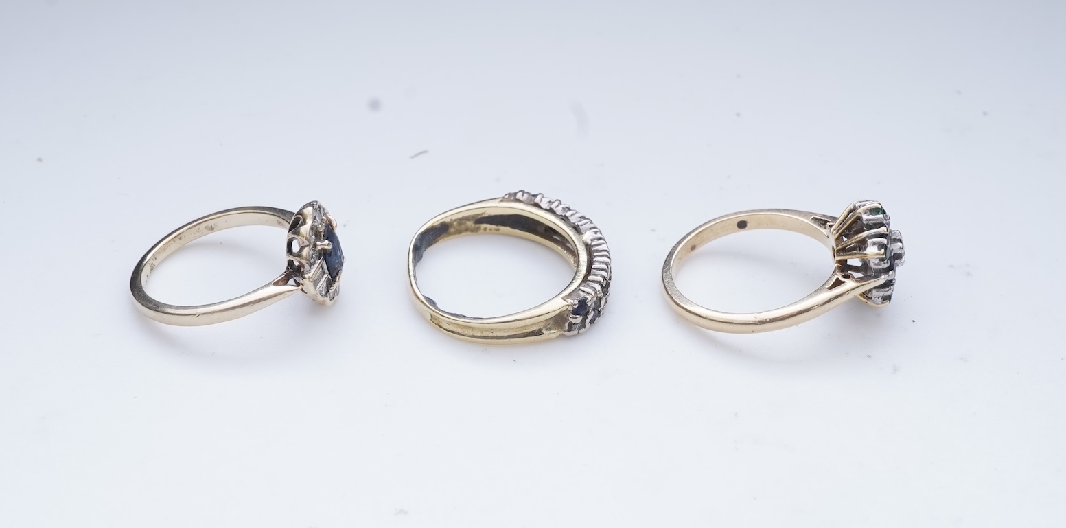 A collection of three sapphire and diamond rings